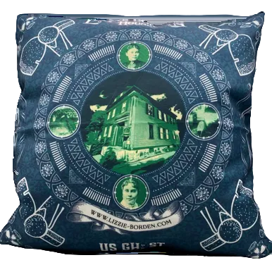 Decorative pillow with a circular design featuring a house and portraits on a blue background.
