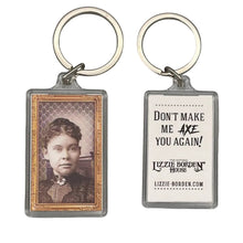 The Lizzie Face Key Chain features a captivating holographic finish that shimmers in the light.