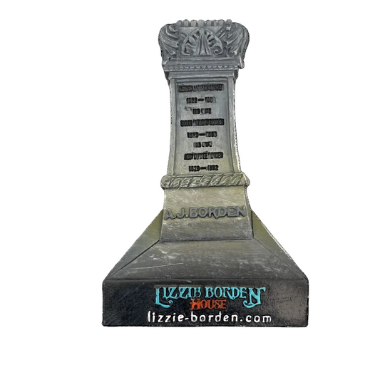 Decorative magnet featuring the image of the Lizzie Borden House gravestone with intricate designs and the name 'LIZZIE BORDEN' prominently displayed.