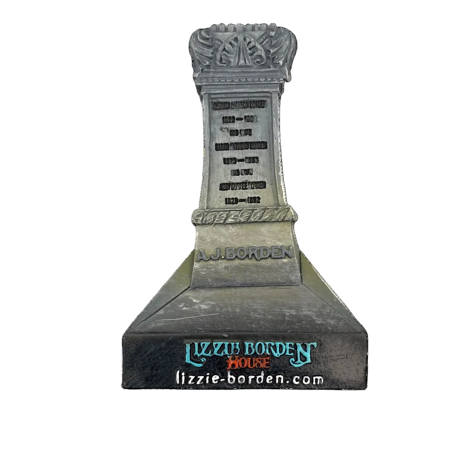 Decorative magnet featuring the image of the Lizzie Borden House gravestone with intricate designs and the name 'LIZZIE BORDEN' prominently displayed.